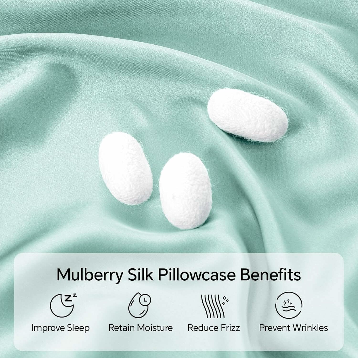 Close-up of light green silk fabric with silk cocoons, highlighting the natural, hypoallergenic, and breathable qualities of the silk pillowcase material.