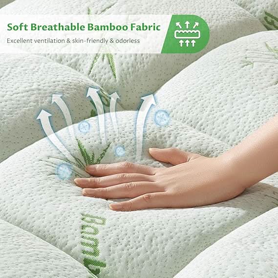 Close-up of a hand pressing into a soft, breathable white quilted mattress topper with airflow design, emphasizing its plush comfort and ventilation features.