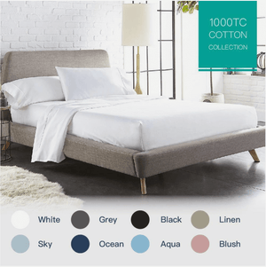 Modern bedroom with a neatly made bed featuring a white quilted mattress topper and soft cotton sheets. A color selection chart at the bottom displays available sheet colors, including white, blue, navy, black, gray, and beige