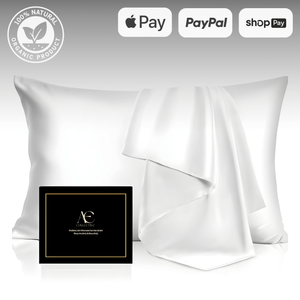 White silk pillowcase set with a matching silk cloth, elegantly displayed alongside a black gift box, highlighting its premium quality and softness