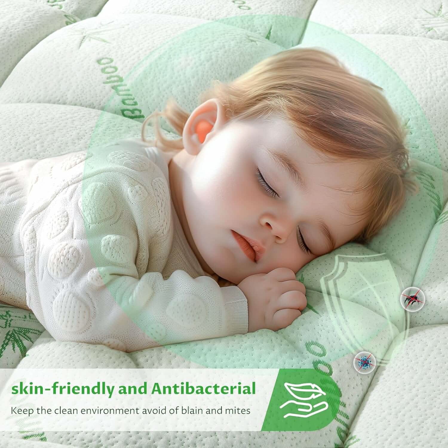 Peaceful sleeping baby on a soft, white quilted mattress topper, highlighting its hypoallergenic and skin-friendly material for a comfortable and safe sleep.