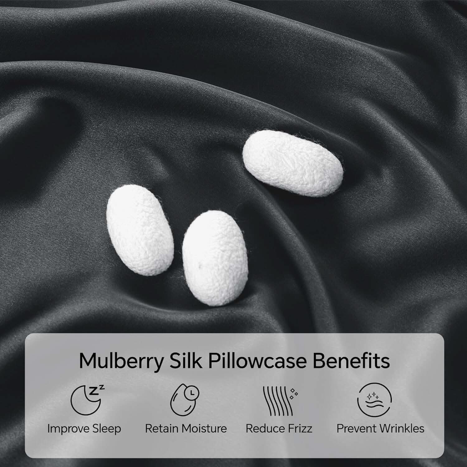 Close-up of black silk fabric with silk cocoons, emphasizing the natural, hypoallergenic, and breathable qualities of the silk pillowcase material.