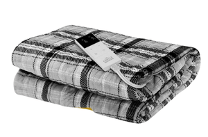 Folded electric heating blanket with plaid design and remote control for adjustable warmth.