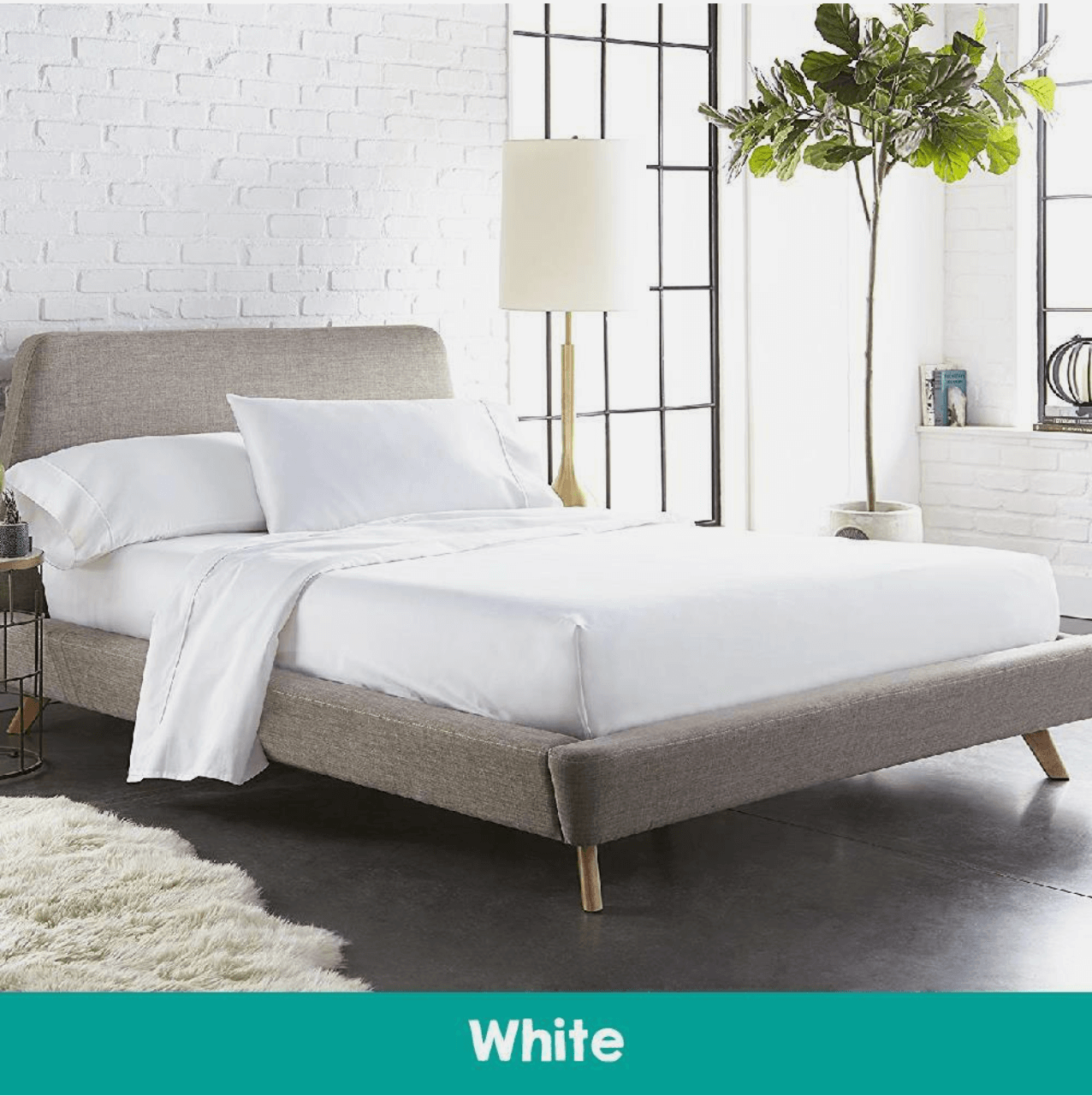 Elegant bedroom with a neatly made bed featuring a white quilted mattress topper and soft cotton sheets, creating a cozy and luxurious sleep environment.