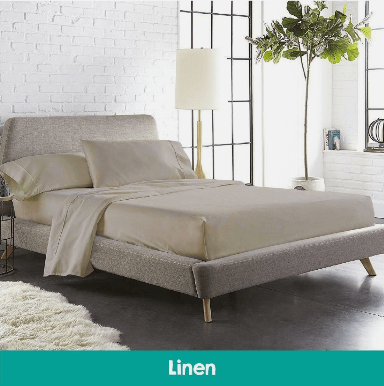 Modern bedroom featuring a bed with beige cotton sheets and a matching quilted mattress topper, creating a warm and inviting sleep space