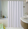 white shower curtain displayed in bathroom setting
