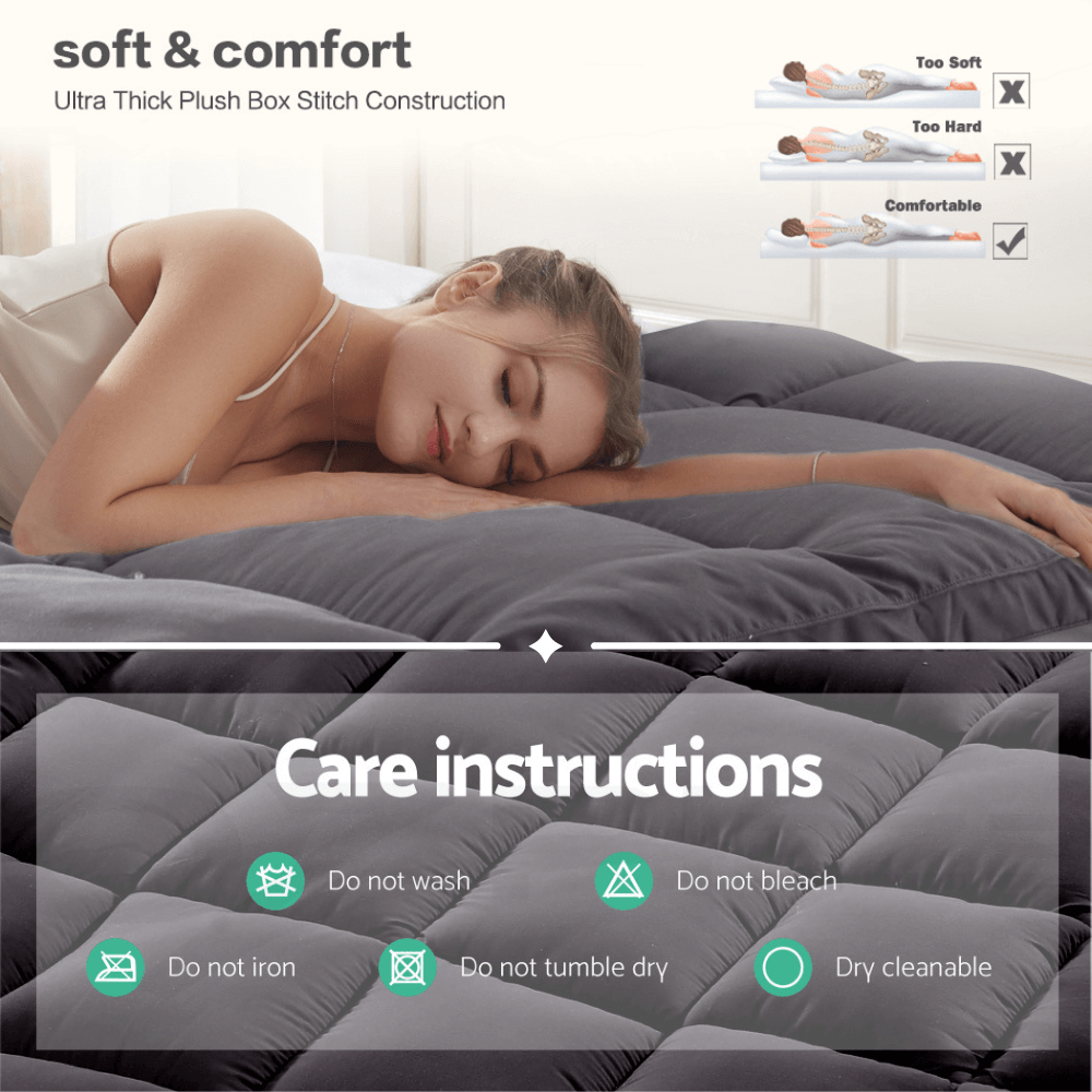 Woman resting on a dark gray quilted mattress topper, highlighting its ultra-soft padding, pressure relief, and even weight distribution for enhanced comfort.