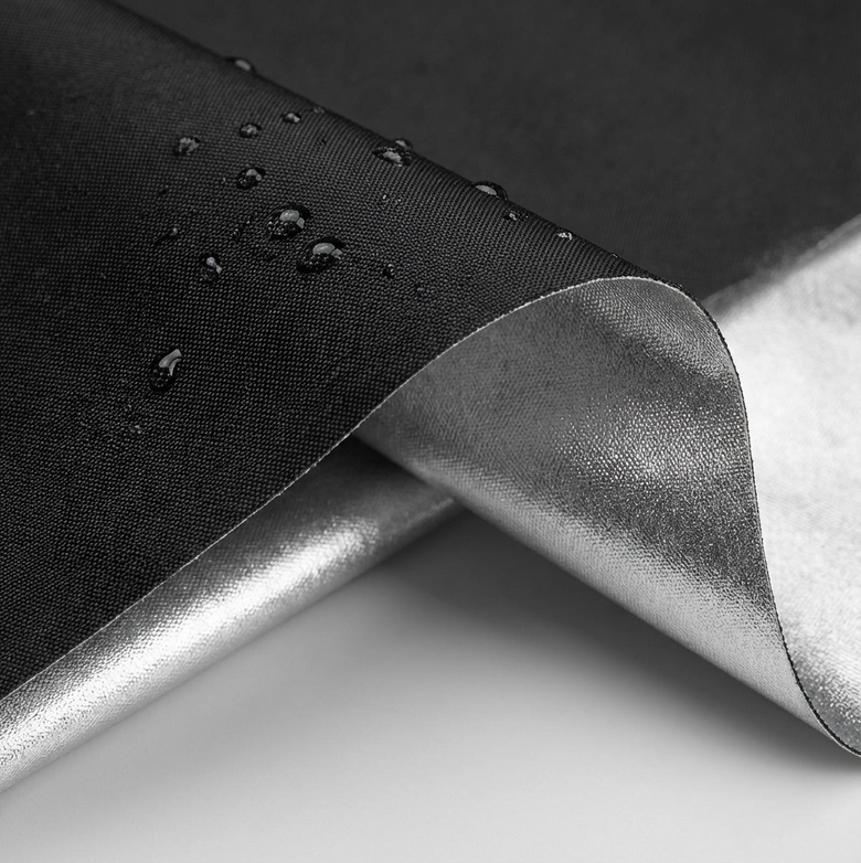 silver insulated layer on blockout blinds demonstrating heat and uv reflection